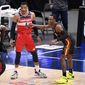 Washington Wizards guard Russell Westbrook (4) stands on the court next to Atlanta Hawks guard Rajon Rondo, right, during the first half of an NBA basketball game, Friday, Jan. 29, 2021, in Washington. (AP Photo/Nick Wass)