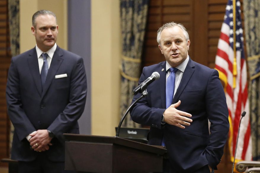 FILE - In this May 4, 2020, file photo, Oklahoma House Speaker Charles McCall, left, R-Atoka, looks on as Senate President Pro Tempore Greg Treat, right, R-Oklahoma City, answers a question at a news conference in Oklahoma City. Oklahoma House and Senate leaders on Friday, Jan. 29, 2021, announced safety protocols for the upcoming legislative session that include encouraging, but not requiring, lawmakers wear masks when at the state Capitol. (AP Photo/Sue Ogrocki, File)