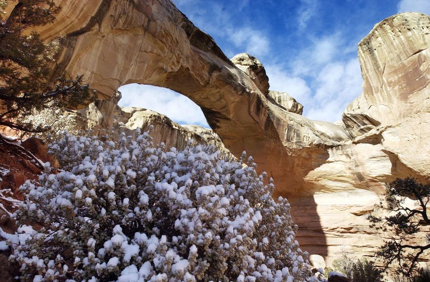 FILE - This undated file photo shows Hickman Arch at Capitol Reef near Torrey, Utah. Capitol Reef National Park has announced its 2021 Artists in Residence program, which pays living expenses for artists to live, work and practice their crafts amid the park's spectacular landscapes. (Danny Chan La/The Salt Lake Tribune via AP, File)