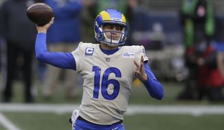 FILE - In this Jan. 9, 2021, file photo, Los Angeles Rams quarterback Jared Goff throws a pass against the Seattle Seahawks during the first half of an NFL wild-card playoff football game in Seattle.The Detroit Lions are trading quarterback Matthew Stafford to the Rams in exchange for Goff, two future first-round picks and a third-round pick, a person with knowledge of the deal tells The Associated Press. The person spoke on condition of anonymity Saturday night, Jan. 30, because the deal has not been completed. (AP Photo/Scott Eklund, File)