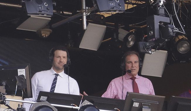 FILE - In this Sept. 24, 2017, file photo, Tony Romo and Jim Nantz work in the broadcast booth before an NFL football game between the Green Bay Packers and the Cincinnati Bengals in Green Bay, Wis.  Nantz and Romo were inseparable when CBS broadcast the Super Bowl two years ago. Next week, they won&#x27;t see each other until they are in the broadcast booth a couple hours prior to kickoff. Keeping announcers separated until game day has been standard practice this season due to the Coronavirus pandemic. (AP Photo/Morry Gash, File)