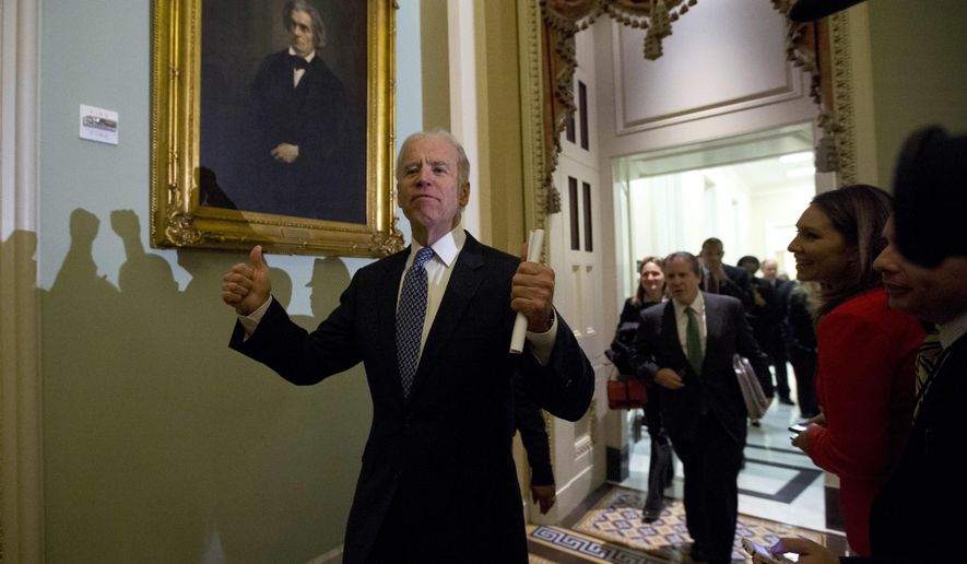 FILE - In this Dec. 31, 2012, file photo Vice President Joe Biden gives two thumbs up following a Senate Democratic caucus meeting about the fiscal cliff on Capitol Hill in Washington. (AP Photo/Alex Brandon, File)