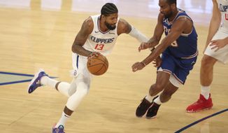 Los Angeles Clippers shooting guard Paul George (13) controls the ball against New York Knicks shooting guard Alec Burks (18) during the first half of an NBA basketball game Sunday, Jan. 31, 2021, in New York. (Brad Penner/Pool Photo via AP)