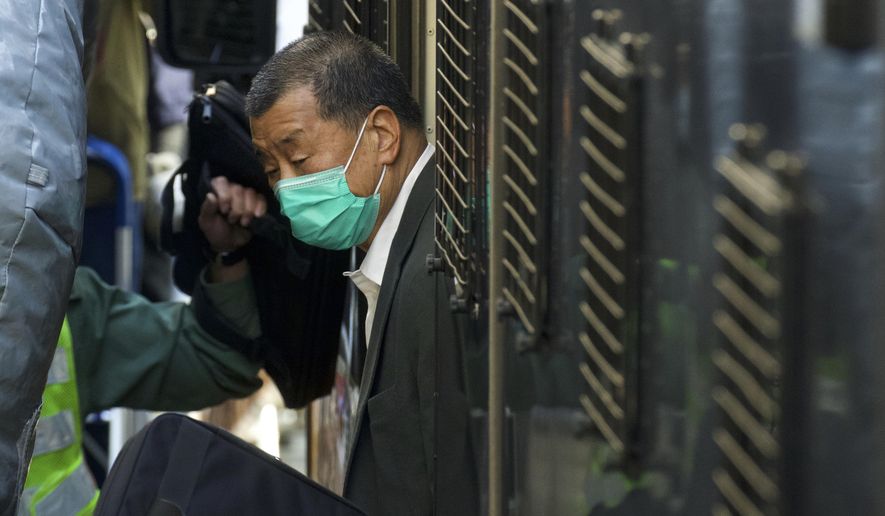 Democracy advocate Jimmy Lai arrives at Hong Kong&#39;s Court of Final Appeal where the government is arguing against allowing him bail in Hong Kong Monday, Feb. 1, 2021. Lai is charged with &amp;quot;collusion&amp;quot; under the new National Security Law that Beijing imposed on Hong Kong last year. (AP Photo/Vincent Yu)