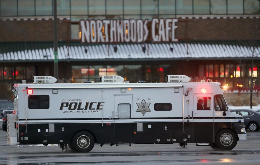 Authorities respond to the Fox River Mall in Grand Chute, Wis., after two people were shot in the mall Sunday, Jan. 31, 2021. (William Glasheen/The Post-Crescent via AP)