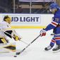 New York Rangers&#39; K&#39;Andre Miller (79) shoots as Pittsburgh Penguins&#39; Casey DeSmith (1) defends during the second period of an NHL hockey game at Madison Square Garden, Monday, Feb. 1, 2021, in New York. (Sarah Stier/Pool Photo via AP)