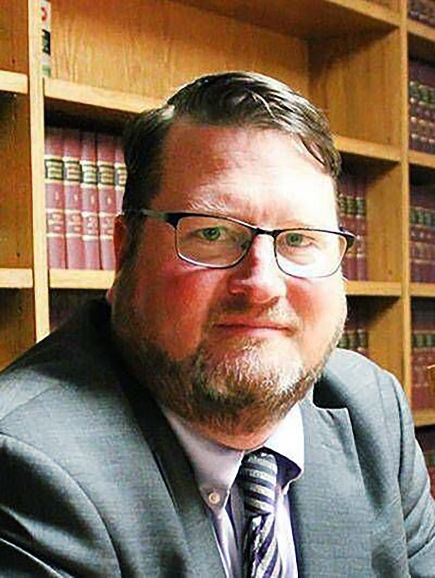 In this June 1, 2018 photo Scott Koerner poses for a photo in Michigan. The Michigan appeals court threw out conspiracy, theft and drug convictions and a six-year prison sentence after finding "true misconduct" by Koemer, a prosecutor in the small county of Shiawassee, Mich. The court was amazed that Koerner didn't disclose that he had represented a co-defendant in the same crime before becoming an assistant prosecutor in Shiawassee County. He's now the elected prosecutor. (The Argus-Press via AP)