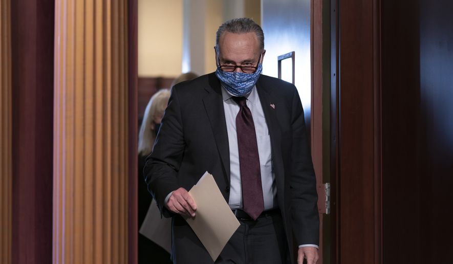 Senate Majority Leader Chuck Schumer, D-N.Y., arrives at a news conference at the Capitol in Washington, Tuesday, Feb. 2, 2021. (AP Photo/J. Scott Applewhite)