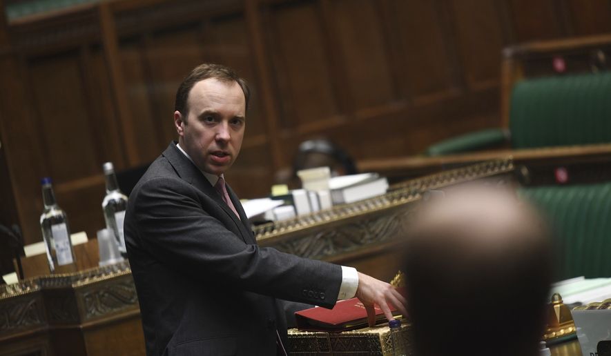 In this handout photo provided by UK Parliament, Britain's Health Secretary Matt Hancock speaks MPs in the House of Commons, London, Tuesday, Feb. 2, 2021. House-by-house COVID-19 testing has begun in some communities in England as authorities try to extinguish a new variant of the coronavirus before it spreads widely and undermines a nationwide vaccination program. Authorities want to reach the 80,000 residents of eight areas where the variant first identified in South Africa is known to be spreading. (Jessica Taylor/UK Parliament via AP)
