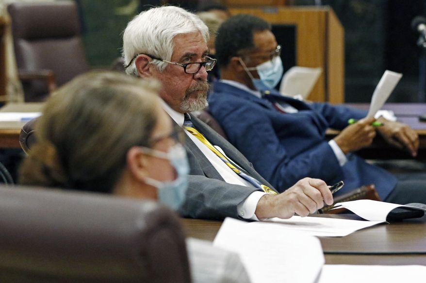 Sen. Kevin Blackwell, R-Southaven, center, listens as members of the Senate Appropriations Committee discuss a grant program supporting small businesses using federal funds proposed by Sen. Josh Harkins, R-Flowood, unseen, during a meeting of the Senate Appropriations Committee, Friday, May 8, 2020 at the Capitol in Jackson, Miss. Lawmakers through various committees are considering requests for monies from the $1.25 billion in Coronavirus Aid, Relief, and Economic Security (CARES) fund. The coronavirus stimulus funds are destined to assist small businesses affected by COVID-19. (AP Photo/Rogelio V. Solis)