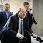 In this Feb. 24, 2020, file photo, Harvey Weinstein arrives at a Manhattan courthouse as jury deliberations continue in his rape trial in New York. A Delaware judge has approved a revised Weinstein Co. bankruptcy plan that provides about $35 million for creditors, with roughly half that amount going to women who&#39;ve accused Weinstein of sexual misconduct. The judge approved the plan following a hearing and overruled objections by attorneys representing four women. (AP Photo/John Minchillo, File)