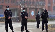 Security personnel manned the entrance of the Wuhan Institute of Virology during a visit this week by a team from the World Health Organization. (Associated Press) ** FILE **
