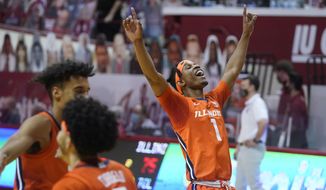 Illinois&#39; Trent Frazier (1) celebrates after Illinois defeated Indiana 75-71 in overtime during an NCAA college basketball game Tuesday, Feb. 2, 2021, in Bloomington, Ind. (AP Photo/Darron Cummings)
