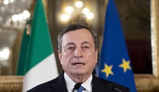 Former European Central Bank president Mario Draghi speaks to the media after accepting a mandate to form Italy&#39;s new government from Italian President Sergio Mattarella at the Rome&#39;s Quirinale Presidential Palace, Wednesday Feb. 3, 2021. (AP Photo/Alessandra Tarantino, Pool)