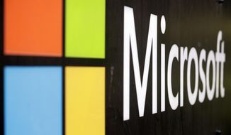 The Microsoft company logo is displayed at their offices in Sydney, Wednesday, Feb. 3, 2021. Microsoft says it supports Australia&#39;s plans to make the biggest digital platforms pay for news and would help small businesses transfer their advertising to Bing if Google quits the country. (AP Photo/Rick Rycroft)