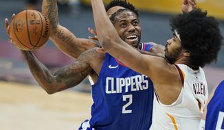 Los Angeles Clippers&#39; Kawhi Leonard (2) drives to the basket against Cleveland Cavaliers&#39; Jarrett Allen (31) during the second half of an NBA basketball game Wednesday, Feb. 3, 2021, in Cleveland. (AP Photo/Tony Dejak)