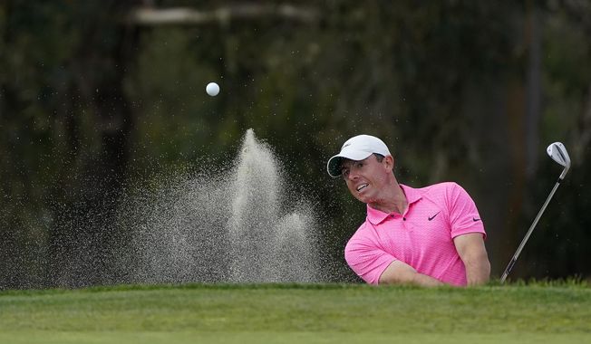 Rory McIlroy, of Northern Ireland, hits out of a bunker to the 13th green on the South Course during the final round of the Farmers Insurance Open golf tournament at Torrey Pines, Sunday, Jan. 31, 2021, in San Diego. (AP Photo/Gregory Bull)