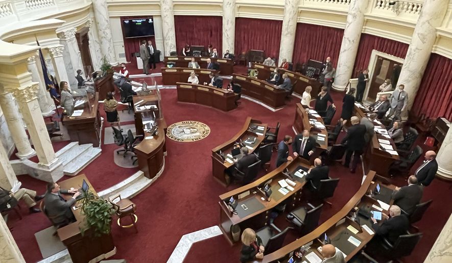 FILE - In this Friday, Jan. 15, 2021, file photo, the Idaho Senate gathers in the Statehouse in Boise, Idaho. A proposed constitutional amendment that would prevent the legalization of pot and other psychoactive drugs has cleared the Idaho Senate and is headed to the House. (AP Photo/Keith Ridler, File)