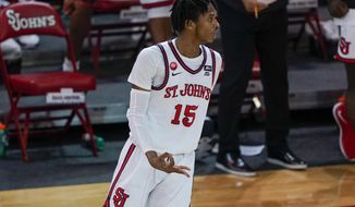 St. John&#39;sVince Cole (15) gestures after making a three point basket during the second half of an NCAA college basketball game against Villanova Wednesday, Feb. 3, 2021, in New York. (AP Photo/Frank Franklin II)