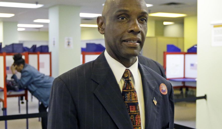 FILE - This Tuesday, Oct. 7, 2014 file photo shows Ohio senate candidate Cecil Thomas arriving at the Hamilton County Board of Elections, on the first day of early voting in Cincinnati. Thomas, an Ohio Democratic state senator said Wednesday, Feb. 3, 2021 he left a committee hearing because so many members of the public weren't wearing masks. Thomas, a second-term lawmaker from Cincinnati, tweeted a picture showing several people in the Senate Government Oversight and Reform Committee without masks. (AP Photo/Al Behrman, File)
