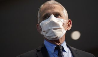 In this Dec. 22, 2020, file photo, Dr. Anthony Fauci, director of the National Institute of Allergy and Infectious Diseases, speaks before receiving his first dose of the COVID-19 vaccine at the National Institutes of Health, in Bethesda, Md.  (AP Photo/Patrick Semansky, Pool, File)