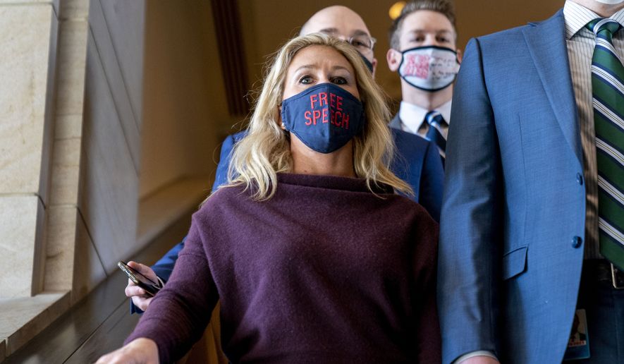Rep. Marjorie Taylor Greene, R-Ga., goes back to her office after speaking on the floor of the House Chamber on Capitol Hill in Washington, Thursday, Feb. 4, 2021. (AP Photo/Andrew Harnik)