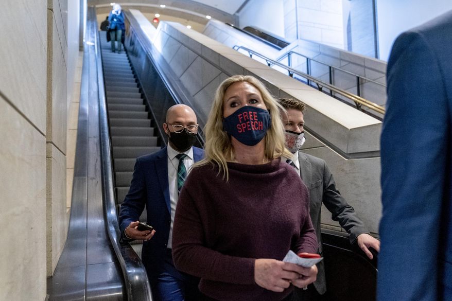 Rep. Marjorie Taylor Greene, R-Ga., goes back to her office after speaking on the floor of the House Chamber on Capitol Hill in Washington, Thursday, Feb. 4, 2021. (AP Photo/Andrew Harnik)