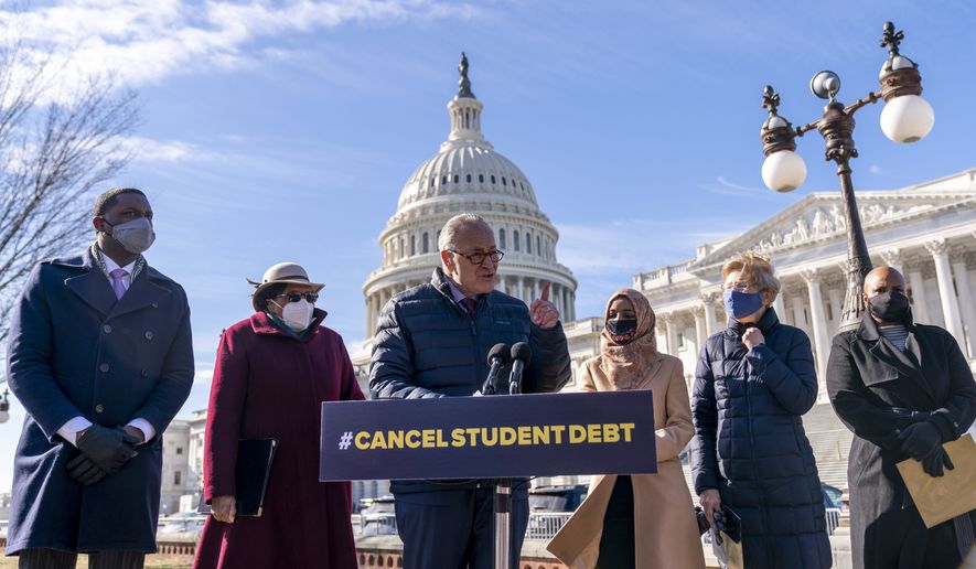 Senate Majority Leader Sen. Chuck Schumer of N.Y., center, accompanied by from left, Rep. Mondaire Jones, D-N.Y., D-Mass., Rep. Alma Adams, D-N.C., Rep. Ilhan Omar, D-Minn., Sen. Elizabeth Warren, D-Mass., and Rep. Ayanna Pressley, speaks at a news conference on Capitol Hill in Washington, Thursday, Feb. 4, 2021, about plans to reintroduce a resolution to call on President Joe Biden to take executive action to cancel up to $50,000 in debt for federal student loan borrowers. (AP Photo/Andrew Harnik) ** FILE **