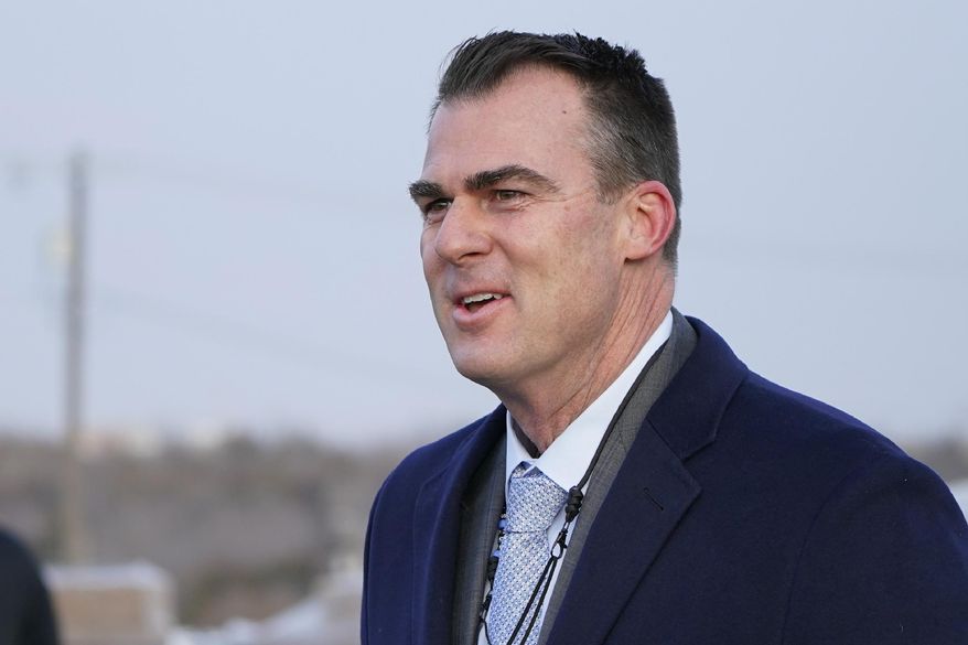 FILE - In this Tuesday, Jan. 26, 2021 file photo, Oklahoma Gov. Kevin Stitt talks with the media in Oklahoma City. A new legislative watchdog agency has delivered a scathing report on how Stitt's administration spent millions of dollars of federal coronavirus relief funds. The report is particularly critical of spending on things loosely connected to the pandemic. (AP Photo/Sue Ogrocki, File)