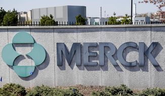 FILE- This May 1, 2018, file photo shows Merck corporate headquarters in Kenilworth, N.J. Merck posted a big fourth-quarter loss, mainly due to much higher spending on research, production and overhead, and announced longtime chief executive, Kenneth Frazier, will retire on July 1, 2021.  (AP Photo/Seth Wenig, File)
