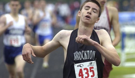 In this June 7, 2003, photo, Brockton High School runner Keith Gill finishes the boys mile race at the 2003 All State Meet Championship in Norwell, Mass. Gill, a YouTube personality known as Roaring Kitty, became a figurehead in the January 2020 social media-driven GameStop stock-buying frenzy. (Craig Murray/The Enterprise via AP)