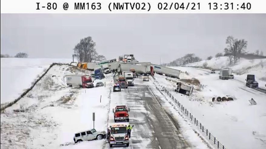 This image provided by the Iowa Transportation Department from a traffic camera shows a massive pileup on Interstate 80, Thursday, Feb. 4, 2021, west of Newton, Iowa. A snowy section of Interstate 80 was closed Thursday afternoon in central Iowa, after the massive crash involving roughly 40 vehicles. Iowa authorities closed the eastbound lanes of the interstate west of Newton after the chain-reaction crash. (Iowa Transportation Department via AP)