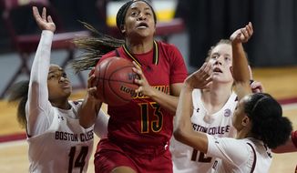 Louisville guard Merissah Russell (13) goes up to shoot against Boston College guard Marnelle Garraud (14), forward Ally Vantimmeren (12) and guard Jaelyn Batts, far right, in the first half of an NCAA college basketball game, Thursday, Feb. 4, 2021, in Boston. (AP Photo/Elise Amendola)