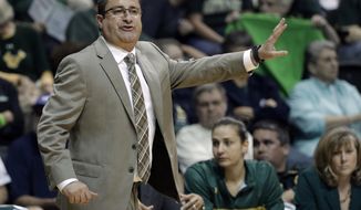 FILE - In this Feb. 27, 2017, file photo, South Florida coach Jose Fernandez calls a play during the first half of the team&#39;s NCAA college basketball game against Connecticut in Tampa, Fla. It&#39;s been a rough few weeks for Jose Fernandez and his South Florida team. The 14th-ranked Bulls were put on pause because of COVID-19 issues on Jan. 21, 2021 when a Tier I member in the women&#39;s basketball program tested positive. They&#39;ve had other Tier I individuals test positive over the last two weeks, including one on Sunday, Monday and Tuesday. (AP Photo/Chris O&#39;Meara, File)