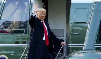 In this Wednesday, Jan. 20, 2021, photo, President Donald Trump waves as he boards Marine One on the South Lawn of the White House, in Washington, en route to his Mar-a-Lago Florida Resort. AP Photo/Alex Brandon) **FILE**