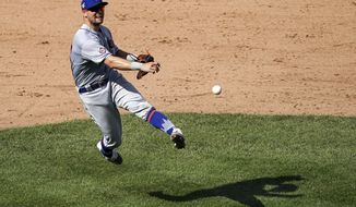 FILE - In this Aug. 29, 2020, file photo, New York Mets third baseman J.D. Davis (28) throws out New York Yankees&#x27; Aaron Hicks at first after fielding a ground ball during the eighth inning of a baseball game in New York. Davis and the Mets argued the first of 13 scheduled salary arbitration cases this month. The third baseman and outfielder asked for a raise from $592,463 to $2,475,000 during Tuesday’s hearing before Gil Vernon, Mark Burstein and Jeanne Vonhof. The Mets argued for $2.1 million. Davis is eligible for arbitration for the first time. (AP Photo/John Minchillo, File)