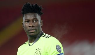 Ajax&#39;s goalkeeper Andre Onana reacts during the Champions League group D soccer match between Liverpool and Ajax at Anfield stadium in Liverpool, England, Tuesday, Dec. 1, 2020. (Michael Regan/Pool via AP)