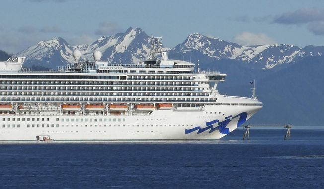 FILE - In this May 30, 2018, file photo, is the Grand Princess cruise ship in Gastineau Channel in Juneau, Alaska. The Canadian government has extended a ban on cruise ships through February 2022, which is expected to block trips from visiting Alaska this year. Transport Canada announced the extension of the ban put in place because of the COVID-19 pandemic. (AP Photo/Becky Bohrer, File)
