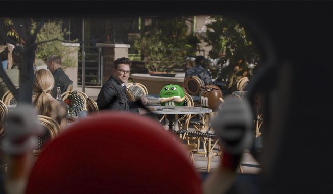 This photo provided by M&amp;amp;M&#x27;s shows a scene from M&amp;amp;M&#x27;s 2021 Super Bowl NFL football spot featuring Dan Levy. (M&amp;amp;M&#x27;s via AP)