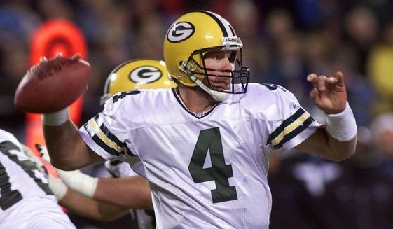 In this Nov. 27, 2000, file photo, Green Bay Packers quarterback Brett Favre looks to pass during the second quarter against the Carolina Panthers of an NFL football game in Charlotte, N.C. Favre looks at the quarterbacks on display this weekend with an admiration as strong as the throws he made as a Pro Football Hall of Fame player. (AP Photo/Rick Havner, File)