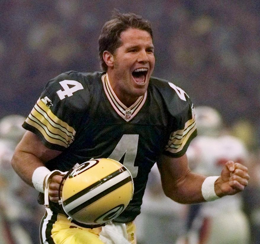 FILE - In this Jan. 26, 1997, file photo, Green Bay Packers quarterback Brett Favre celebrates after throwing a touchdown pass to Andre Rison during the NFL football Super Bowl in New Orleans. Favre looks at the quarterbacks on display this weekend with an admiration as strong as the throws he made as a Pro Football Hall of Fame player. (AP Photo/Doug Mills, File)