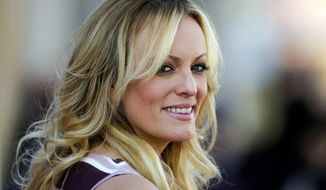 FILE - In this Oct. 11, 2018, file photo, adult film actress Stormy Daniels attends the opening of the adult entertainment fair &amp;quot;Venus,&amp;quot; in Berlin. When Donald Trump left the White House in January 2021, he remained &amp;quot;Individual-1&amp;quot; in the federal campaign finance crimes case against his former attorney, Michael Cohen. The prosecution stemmed from six-figure payments Cohen arranged to Daniels and former Playboy model Karen McDougal, to keep them quiet during the campaign about alleged affairs with Trump. (AP Photo/Markus Schreiber, File)