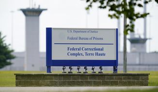 FILE - This Aug. 28, 2020, file photo shows the federal prison complex in Terre Haute, Ind. Two journalists tested positive for coronavirus after witnessing the Trump administration&#39;s final three federal executions, but the Bureau of Prisons knowingly withheld the diagnoses from other media witnesses and did not perform any contact tracing. (AP Photo/Michael Conroy, File)