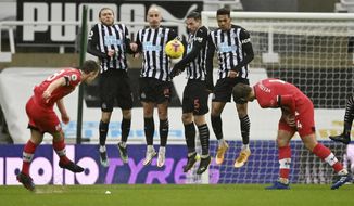 Southampton&#x27;s James Ward-Prowse, left, scores his side&#x27;s 2nd goal on a free-kick, during the English Premier League soccer match between Newcastle United and Southampton, at St. James&#x27; Park Stadium in Newcastle, England, Saturday, Feb. 6, 2021. (Stu Forster, Pool via AP)