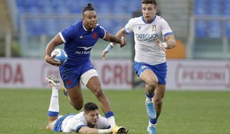 France&#39;s Teddy Thomas breaks clear to set-up another try during the Six Nations rugby union international between Italy and France at Rome&#39;s Olympic stadium, Saturday, Feb. 6, 2021. (AP Photo/Gregorio Borgia)