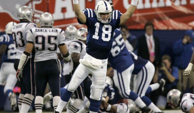 FILE - In this Jan. 21, 2007, file photo, Indianapolis Colts quarterback Peyton Manning (18) celebrates running back Joseph Addai&#x27;s three-yard touchdown run in the fourth quarter of the AFC Championship football game against the New England Patriots, in Indianapolis. Charles Woodson beat out Peyton Manning for a prestigious college award. Something called the Heisman Trophy. On Saturday, Feb. 6, 2021, they likely will share an even more impressive football honor: entry into the Pro Football Hall of Fame. (AP Photo/Amy Sancetta, File)