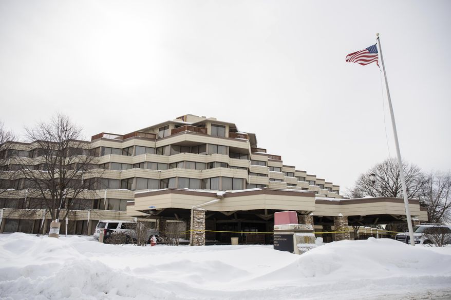 Police investigate the scene of a shooting at the Indian Lakes Hotel on Saturday, Feb. 6, 2021 in Bloomingdale, Ill. Police say one person was killed and several others were injured in a shooting at the hotel in the Chicago suburb. Police said officers who responded about 2:35 a.m. Saturday to a report of shots fired on the fifth floor of the Indian Lakes Hotel saw several people fleeing the hotel. (Pat Nabong /Chicago Sun-Times via AP)