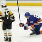 New York Islanders&#39; Anders Lee (27) celebrates after scoring a goal as Pittsburgh Penguins&#39; Brandon Tanev (13) skates away during the third period of an NHL hockey game Saturday, Feb. 6, 2021, in Uniondale, N.Y.  (AP Photo/Frank Franklin II)