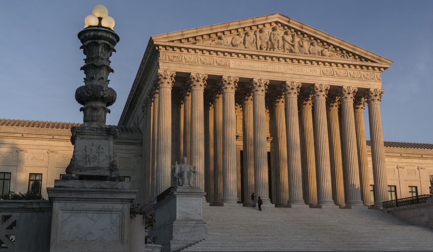 In this Friday, Nov. 6, 2020 file photo, The Supreme Court is seen at sundown in Washington. The Supreme Court is telling California it can&#39;t enforce a ban on indoor church services because of the coronavirus pandemic. The high court issued orders late Friday, Feb. 5, 2021 in two cases where churches had sued over coronavirus-related restrictions in the state. (AP Photo/J. Scott Applewhite, File)  **FILE**