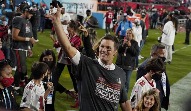 Tampa Bay Buccaneers quarterback Tom Brady walks off the field with his family after the NFL Super Bowl 55 football game against the Kansas City Chiefs Sunday, Feb. 7, 2021, in Tampa, Fla. The Buccaneers defeated the Chiefs 31-9 to win the Super Bowl. (AP Photo/Chris O&#x27;Meara) **FILE**